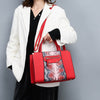 SNAKE SKIN PATTERNED CORAL HANDBAG