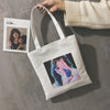 A WOMAN PRINTED CANVAS BAG