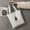 A WOMAN PRINTED CANVAS BAG