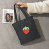 A WOMAN PRINTED CANVAS BAG