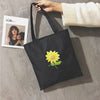 A WOMAN PRINTED CANVAS BAG