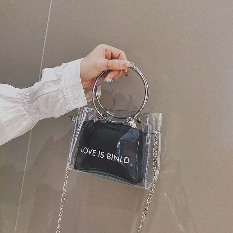 "LOVE IS BINLD" PRINTED TRANSPARENT BAG