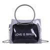 "LOVE IS BINLD" PRINTED TRANSPARENT BAG