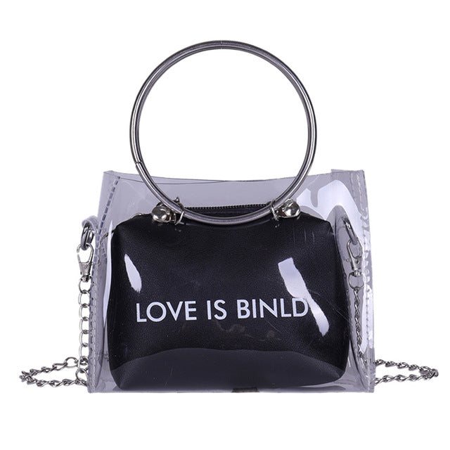 "LOVE IS BINLD" PRINTED TRANSPARENT BAG